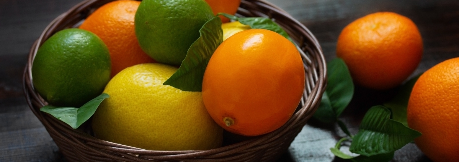Basket of grapefruit, oranges, lemons and limes
